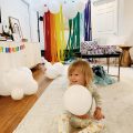 trolls theme birthday for 2nd birthday with balloons and rainbow cloud balloon arch