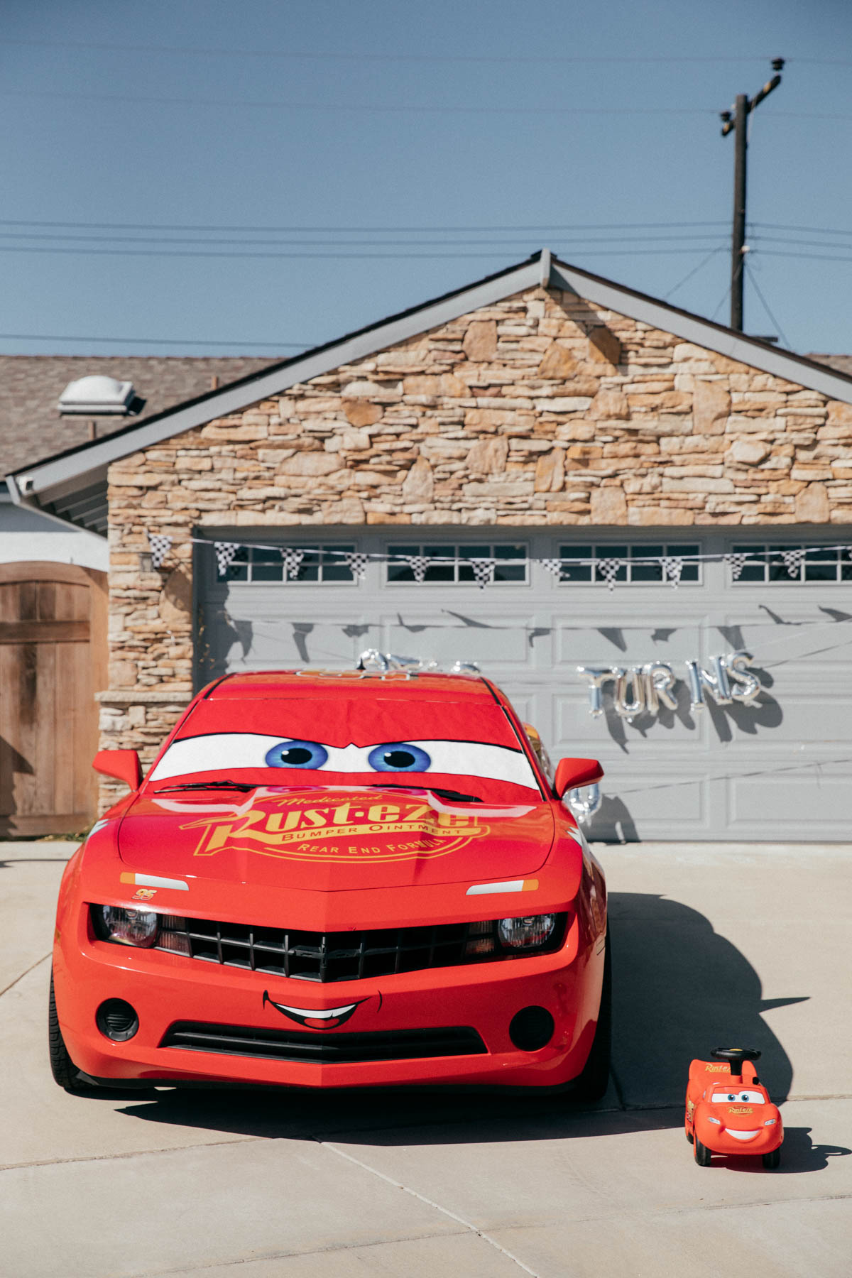 Lightning McQueen Impersonator Car and Ride on Lightning McQueen Car Toy at Disney Pixar Cars themed birthday
