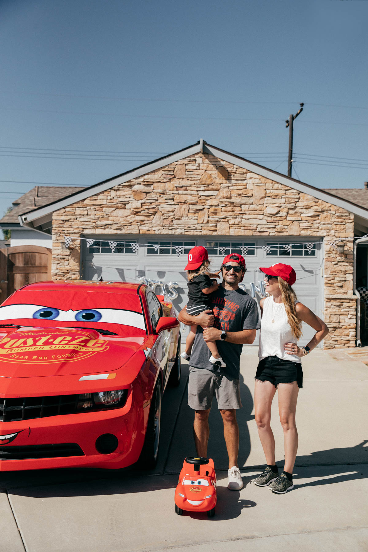 Family photos with Lightning McQueen Impersonator Car at Disney Pixar Cars themed birthday