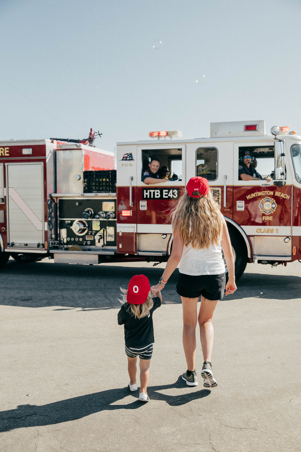 Mother and son walking to Firetruck at Disney Pixar Cars themed birthday