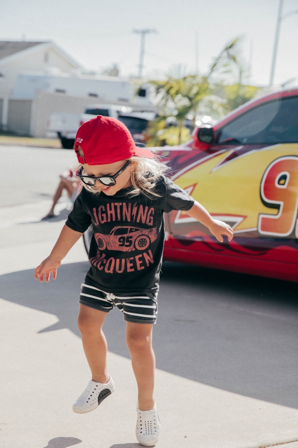 Birthday Boy dancing in front of Lightning McQueen Impersonator at Disney Pixar Cars themed birthday