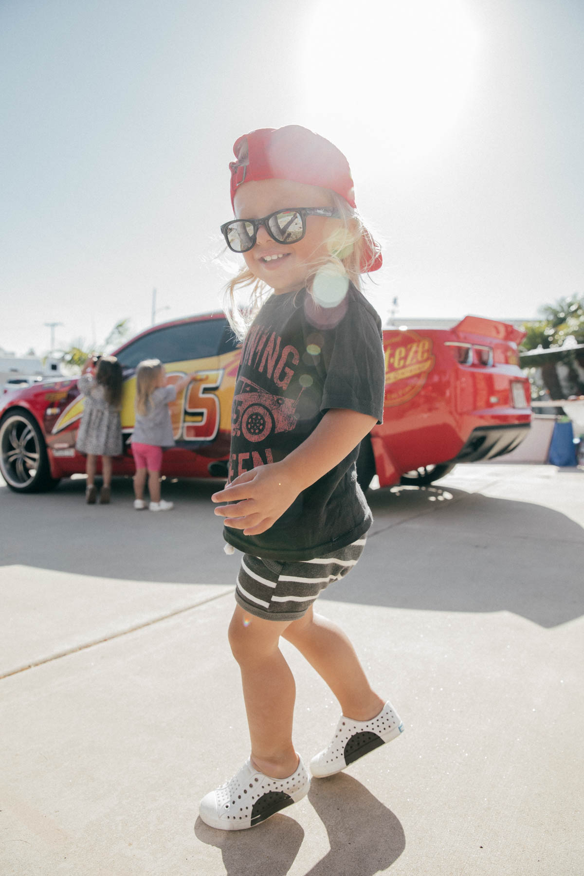 Toddler dancing in front of Lightning McQueen Impersonator at Disney Pixar Cars themed birthday