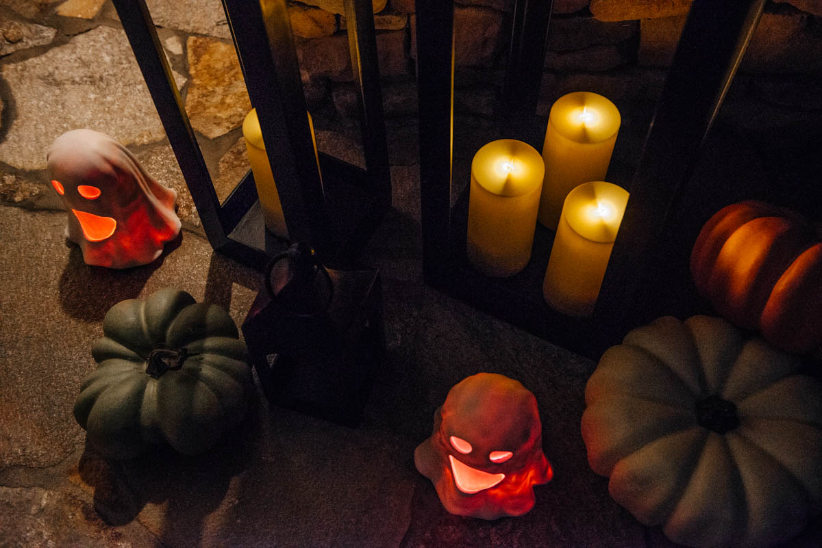 Fall & Halloween Decor For Patio & Yard with Lanterns, faux pumpkins, crow wreath and LED ghosts lit up at night