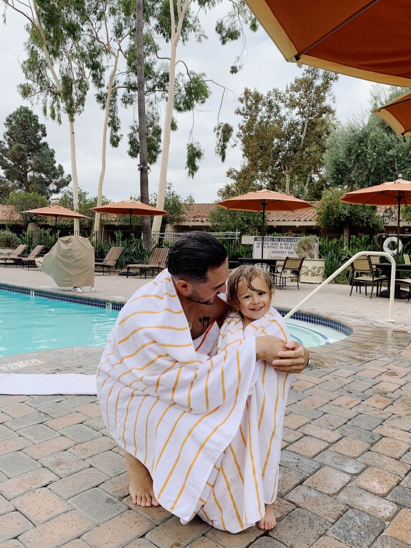 eatsleepwear goes on a family trip with toddler to Rancho Bernardo Inn showing father and son at the pool