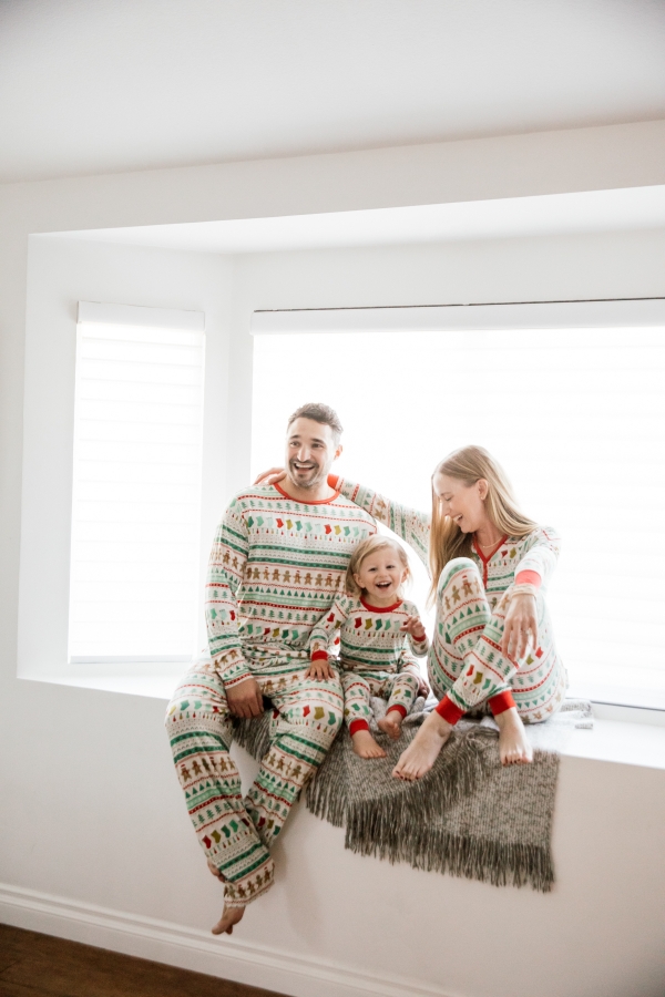 Family in matching Holiday pajamas