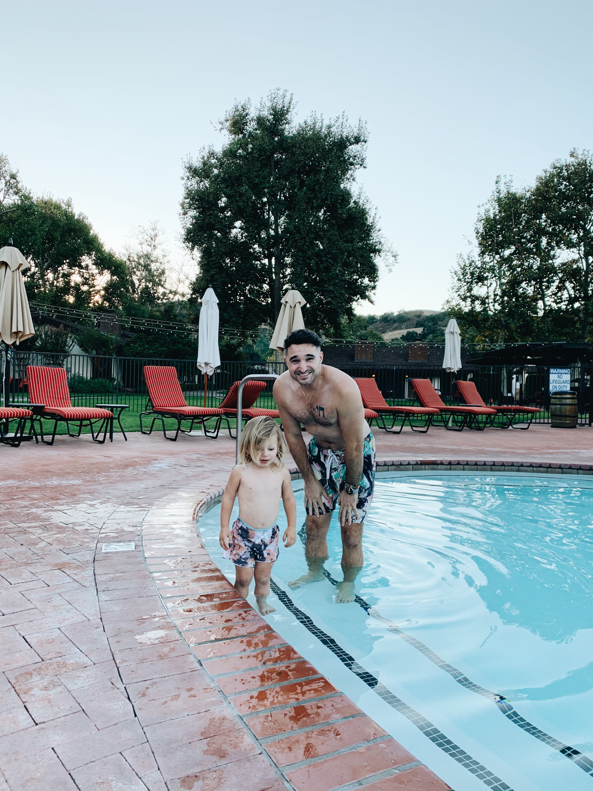 Father and son at pool at Alisal Guest Ranch and Resort 